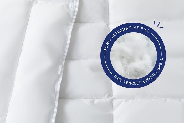 Close-up of the fill inside the Down Alt Duvet. A badge on the image says "Down-Alternative Fill. 100% Tencel™ Lyocell Shell"