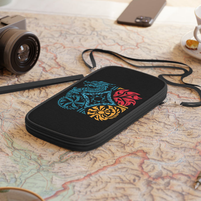 Black passport wallet on a map surface, featuring a dragon crest graphic and zipper top.