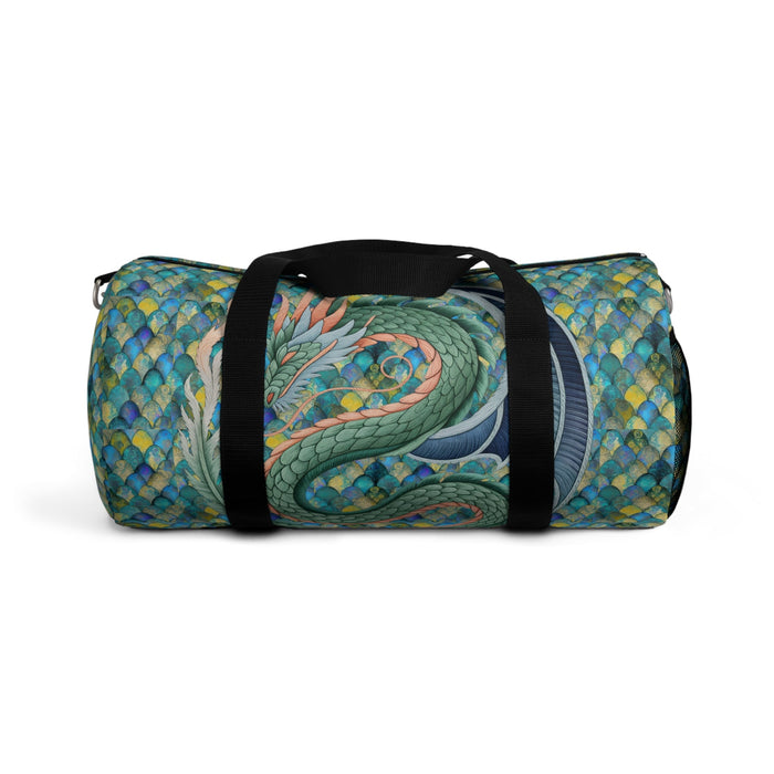 Mermaid-scale duffel bag with dragon print on front, black webbing handles