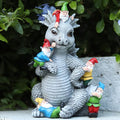 Light gray dragon gnome garden statue with tiny gnomes perched on its back