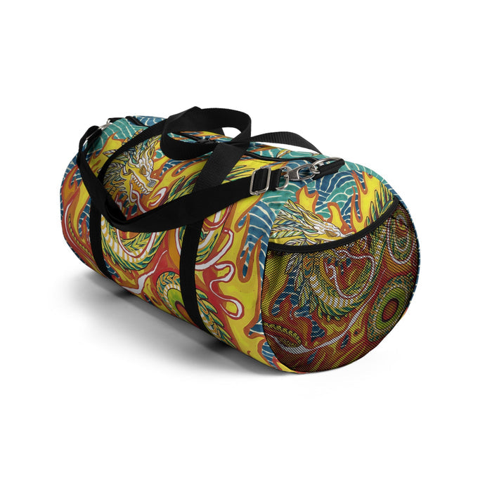 Swirl-pattern duffel bag with black handles and shoulder strap, angled view.
