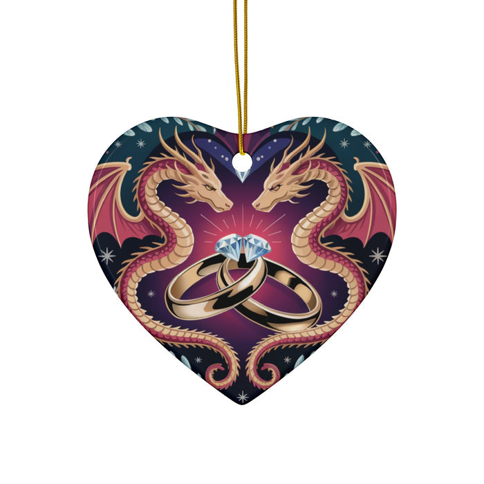 Heart-shaped ceramic ornament with two dragon heads and wedding rings, gold hanging cord