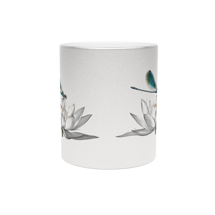 Metallic silver mug with scattered dragonfly and lotus print, no visible handle