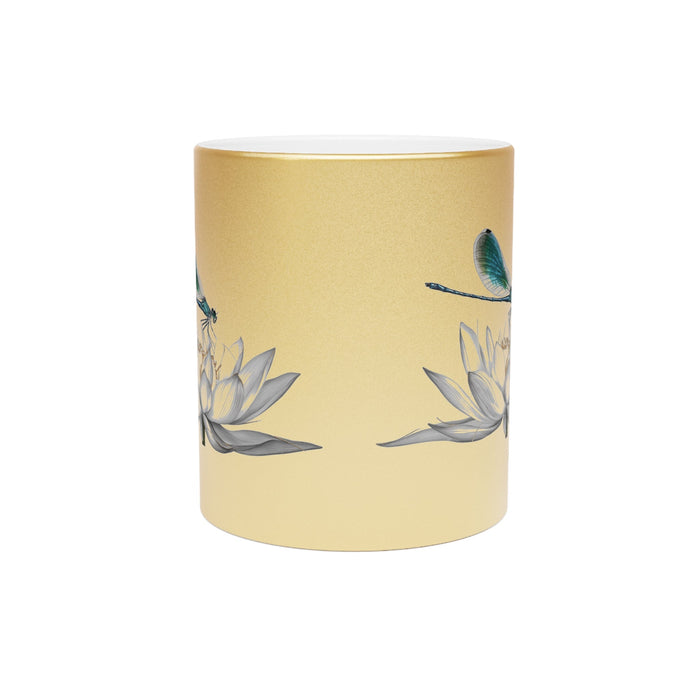 Metallic gold mug with dragonfly and lotus print, partial handle visible