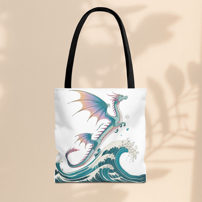 White tote bag with dragon and teal waves print, black handles