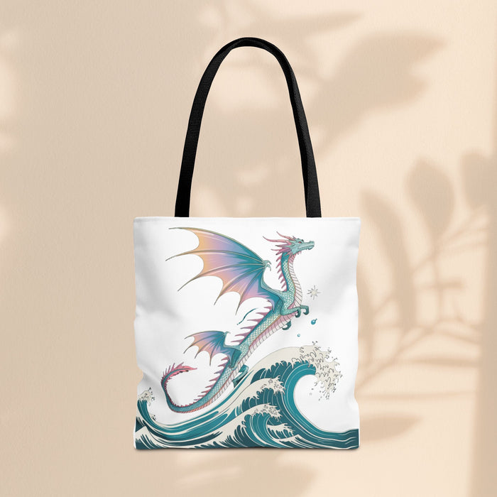 White dragon-themed tote bag with teal waves graphic, black shoulder handles