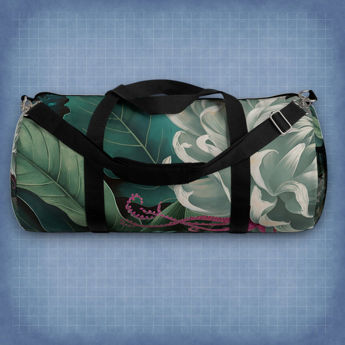 Botanical duffel bag with green floral print, black straps, and zip top