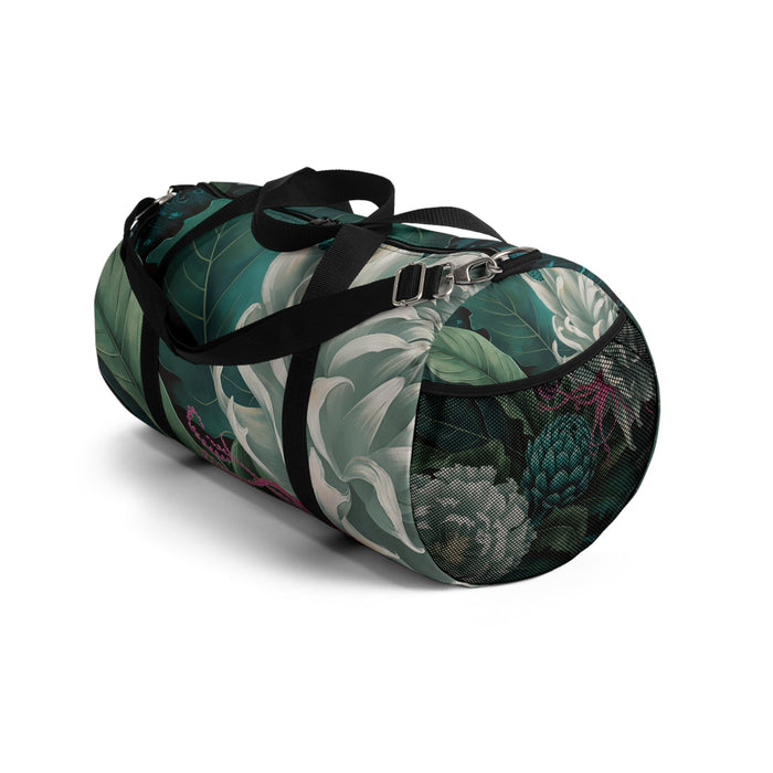 Side view of green botanical duffel bag with black straps and zipper end