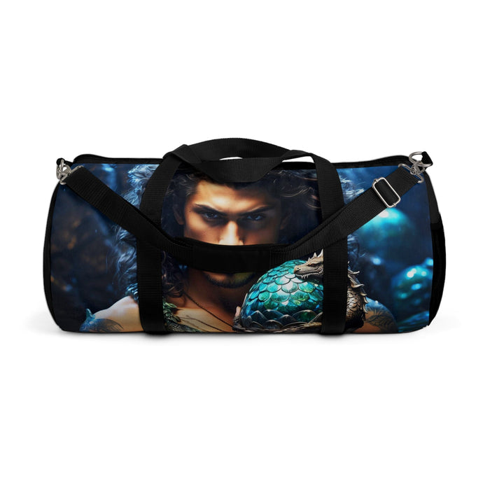 Blue dragon-egg duffel bag with black straps, front portrait panel, and metal rings.