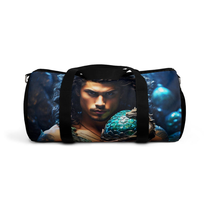 Blue dragon-egg duffel bag with front face artwork and black webbing straps.