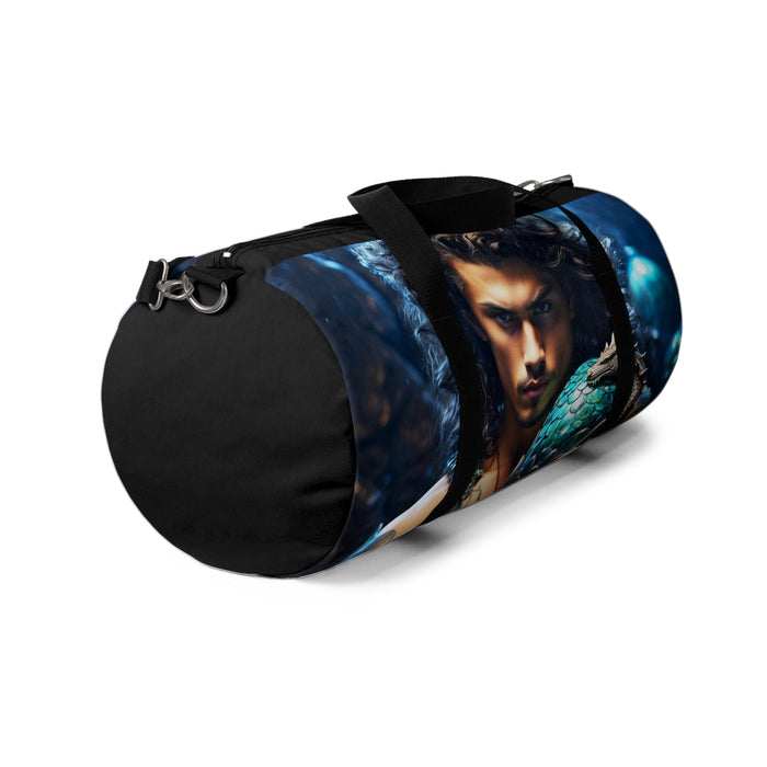 Blue duffel bag with dragon-egg artwork and black strap with metal clips.