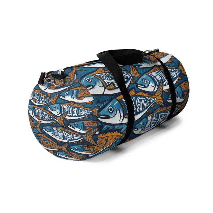 Fish-pattern duffel bag shown from the side, black strap, blue and orange tones.