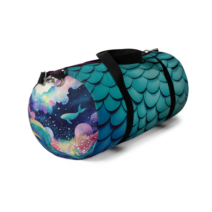 Mermaid-scales duffel bag with colorful galaxy panel on the end and black strap.
