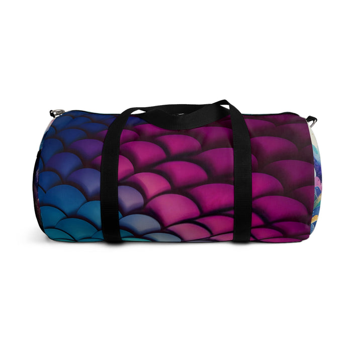 Mermaid-scales duffel bag with dark blue and magenta scales panel and black strap.