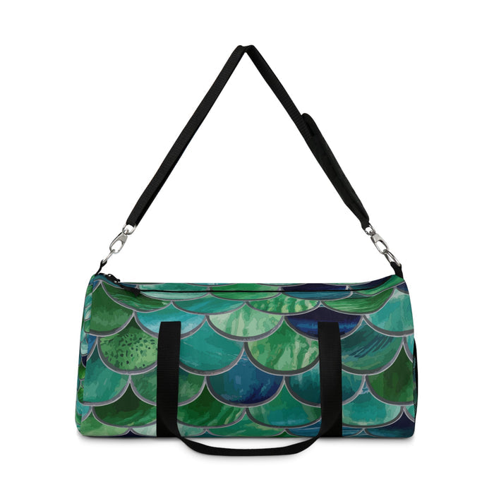Mermaid-scale duffel bag with black top handles and zipper-front panel