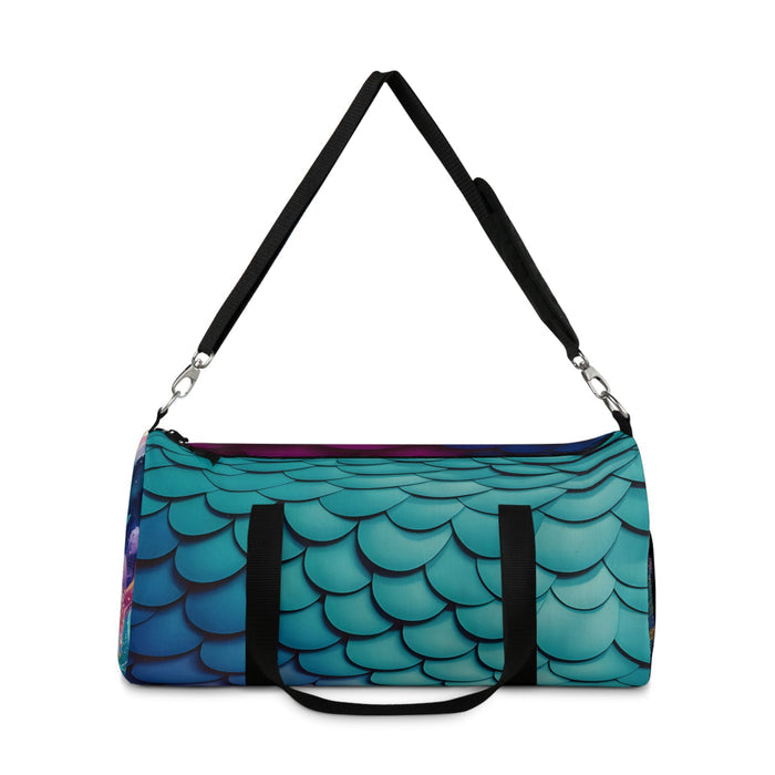 Mermaid-scales duffel bag with black carry handle straps and front pocket panel.