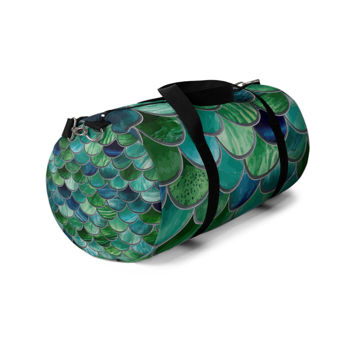 Mermaid scales duffel bag with green-teal scale print and black webbing handles