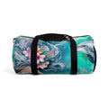 Mermaid print duffel bag with black straps and teal side panel