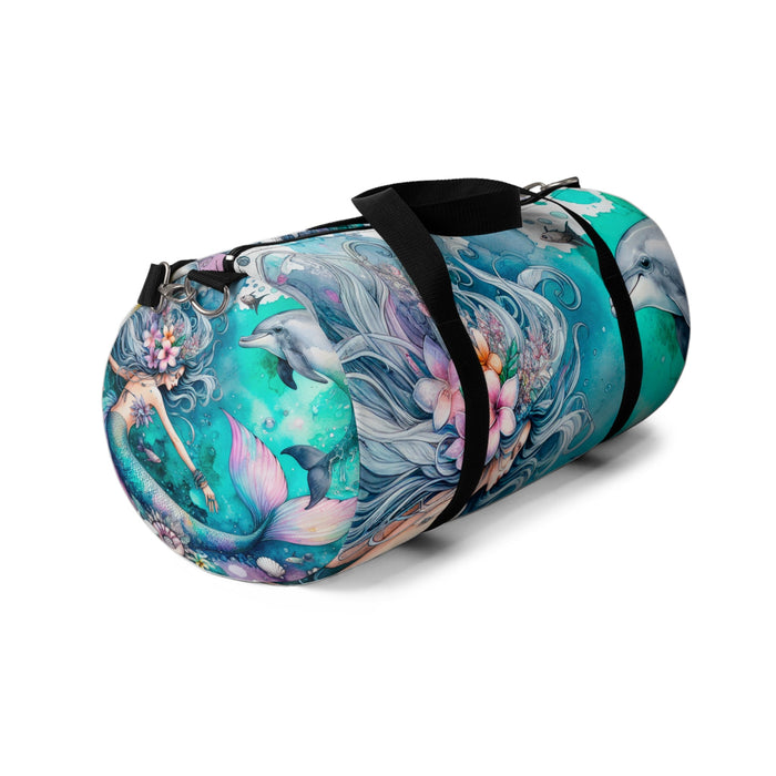 Mermaid print duffel bag with teal dolphin artwork and black carry strap