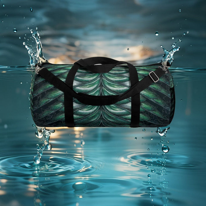 Merman scales duffel bag with black straps, green-blue mermaid scale pattern.