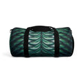 Merman scales duffel bag side view, black straps and green-blue shell scale pattern.