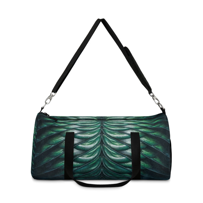 Merman scales duffel bag top-handle view, black straps and green-blue scale print.
