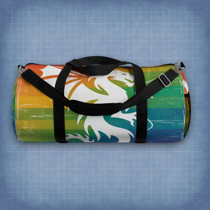 Multicolor striped duffel bag with dragon graphic, black shoulder strap and top handle.