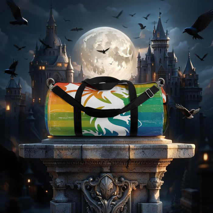 Multicolor striped duffel bag with dragon graphic, black straps and metal D-ring clips.