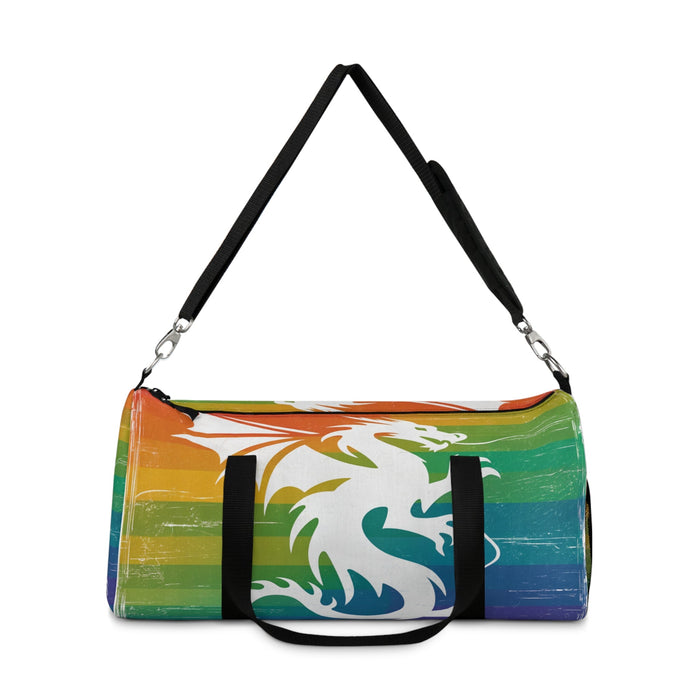 Multicolor striped duffel bag with dragon graphic, black shoulder strap with metal hooks.