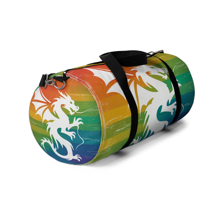 Multicolor striped duffel bag with dragon graphic, black strap with silver D-ring closures.
