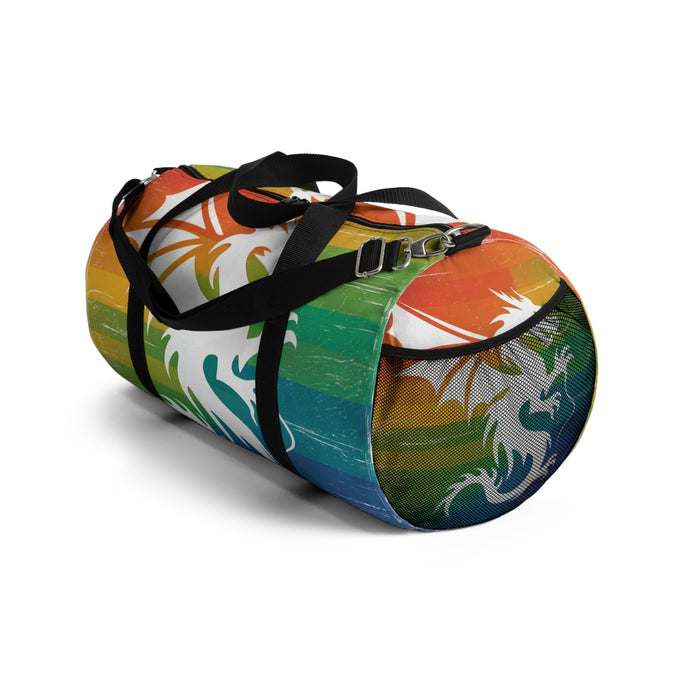 Multicolor striped duffel bag with dragon graphic, black cross strap and silver clips.