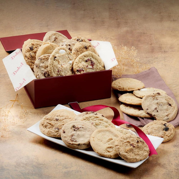 Cookie gift box assortment with open maroon box and assorted crumbly cookies on trays