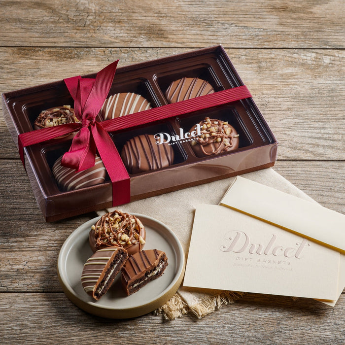 Chocolate-dipped Oreo cookie gift box with dark chocolate pieces and pink ribbon