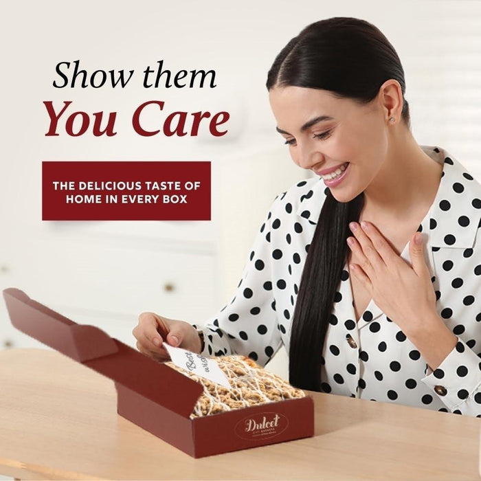 Gift box with cookies held by a woman in a polka-dot outfit