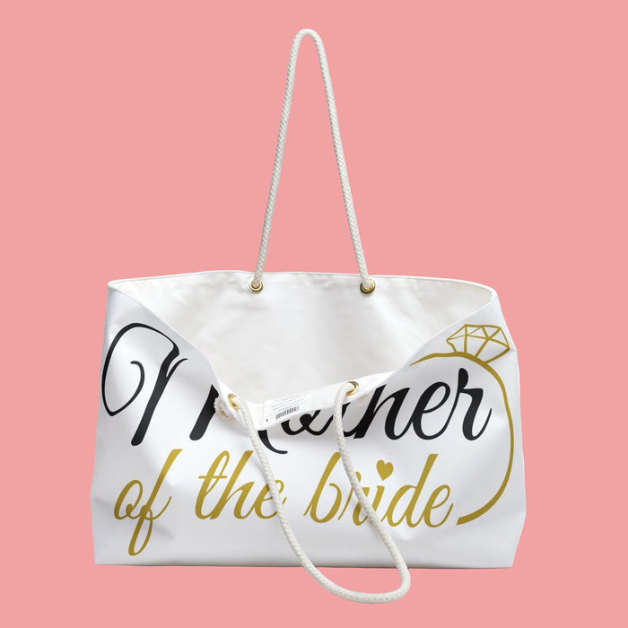 White tote bag with cross-body rope strap and "Mother of the Bride" lettering