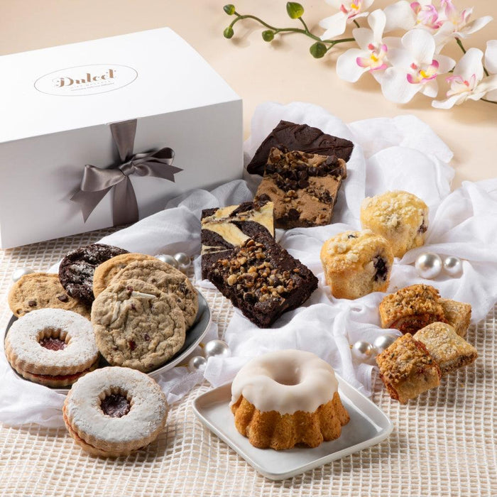 Elegant white deluxe gift box with satin gray bow and logo on the lid