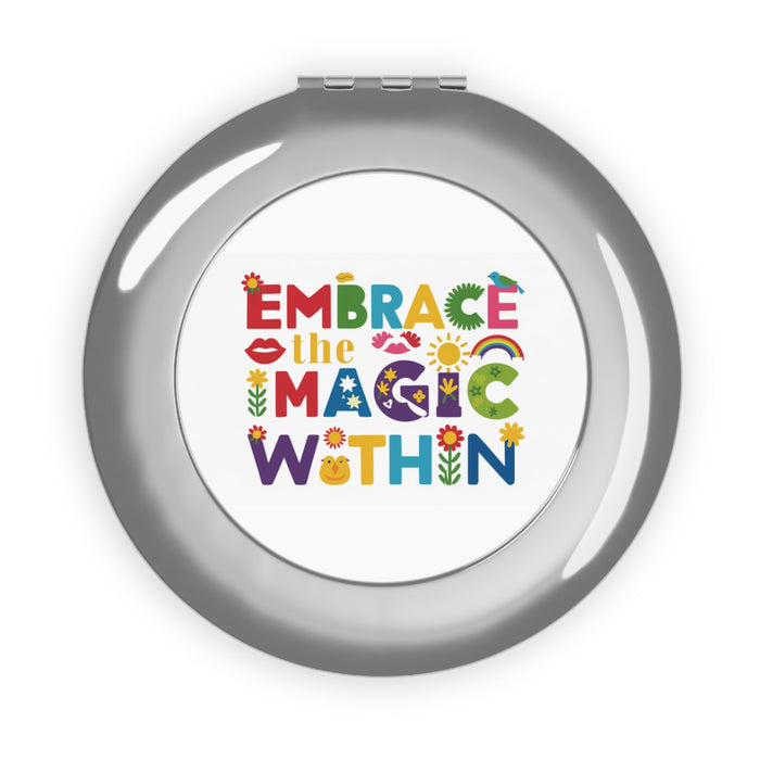 Silver round compact travel mirror, glossy hinged design with colorful printed insert