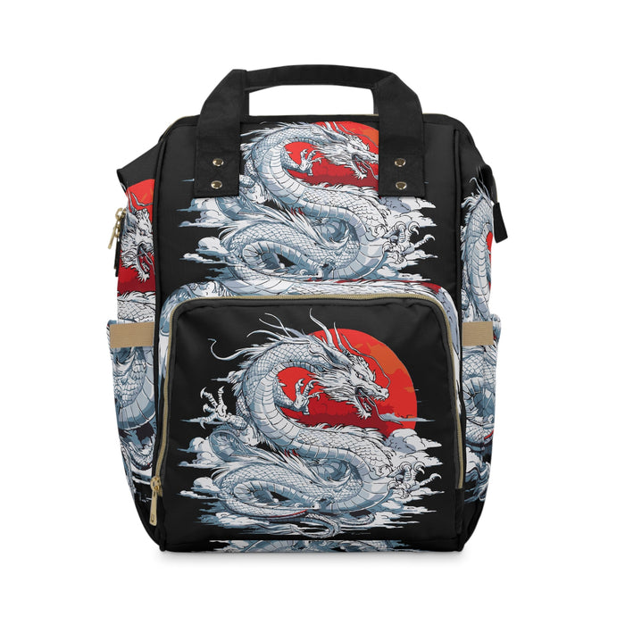 Dragon print diaper backpack with front pocket and top carry handles, black with red accents.