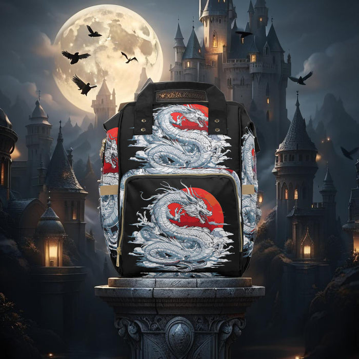 Diaper backpack with large dragon artwork on front and side panels, black with red details.