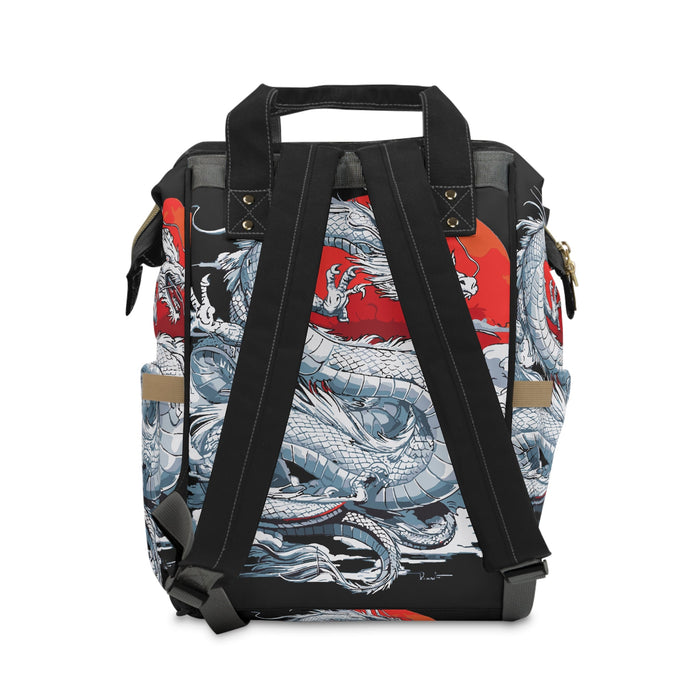 Black diaper backpack with adjustable shoulder straps and dragon print panel detail.