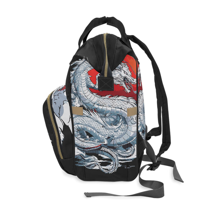 Diaper backpack, side view, featuring dragon illustration and gold-tone hardware accents.