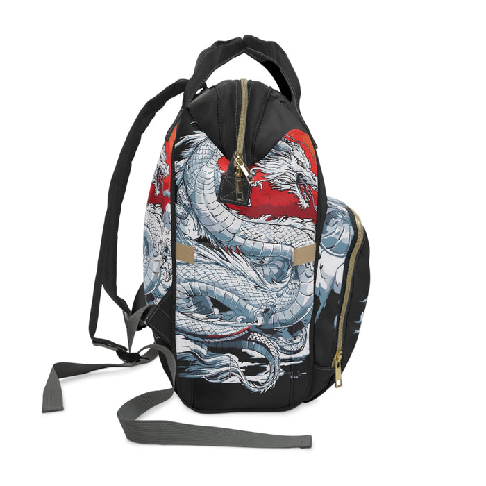 Diaper backpack with top handle and removable shoulder strap, dragon print in black and blue.
