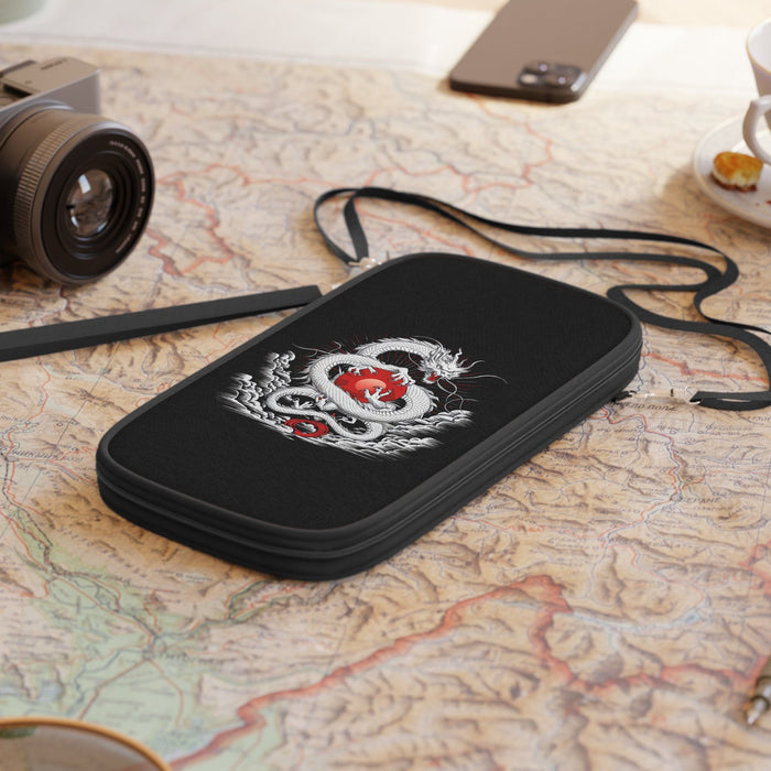 Black passport wallet with dragon embroidery, lying flat with strap visible