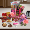 Pink woven gift basket with plush pig, flowers, crayons, and snacks assortment