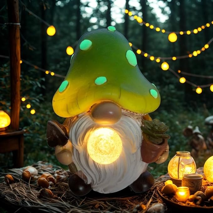 Solar garden gnome statue with green mushroom cap and glowing light, white beard, holding leaves