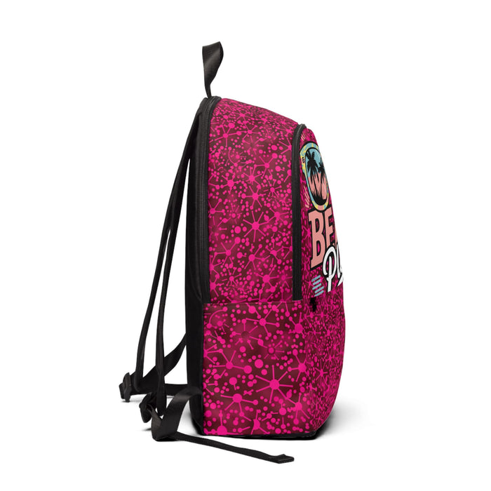 Magenta fabric backpack with beach print, side view, black straps and trim