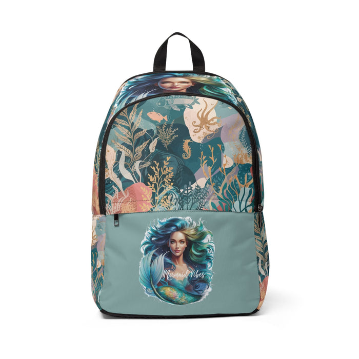 Mermaid print fabric backpack with black trim, teal front panel and top handle.