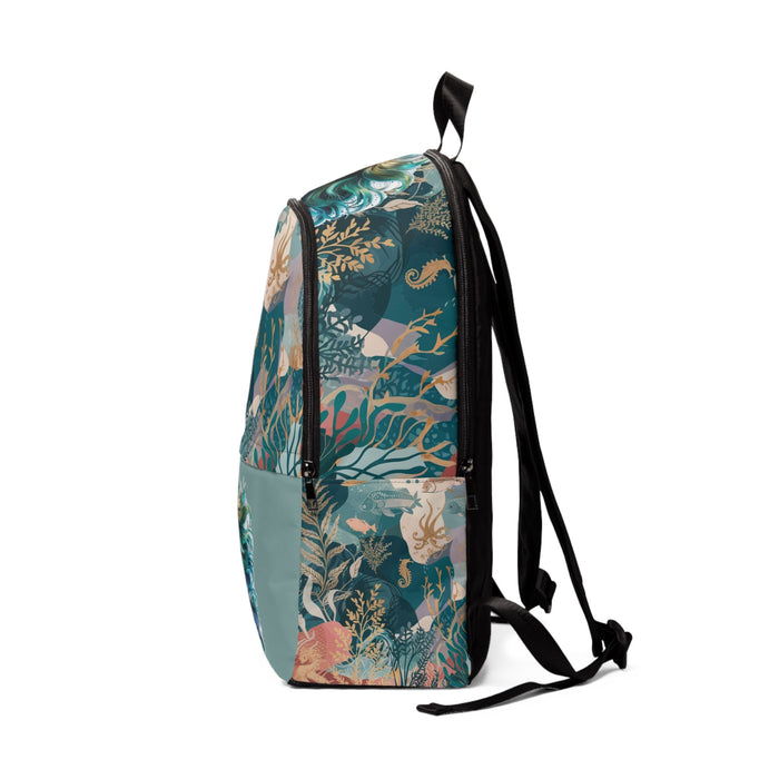 Teal fabric backpack with mermaid print and black shoulder straps, front panel visible.