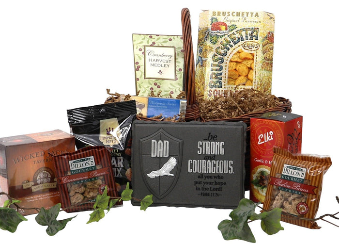 Wicker gift basket holding assorted packaged snacks, crackers, and soup mixes