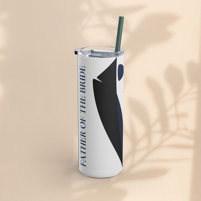 Matte white tumbler with navy tuxedo stripe and vertical text, clear lid and teal straw
